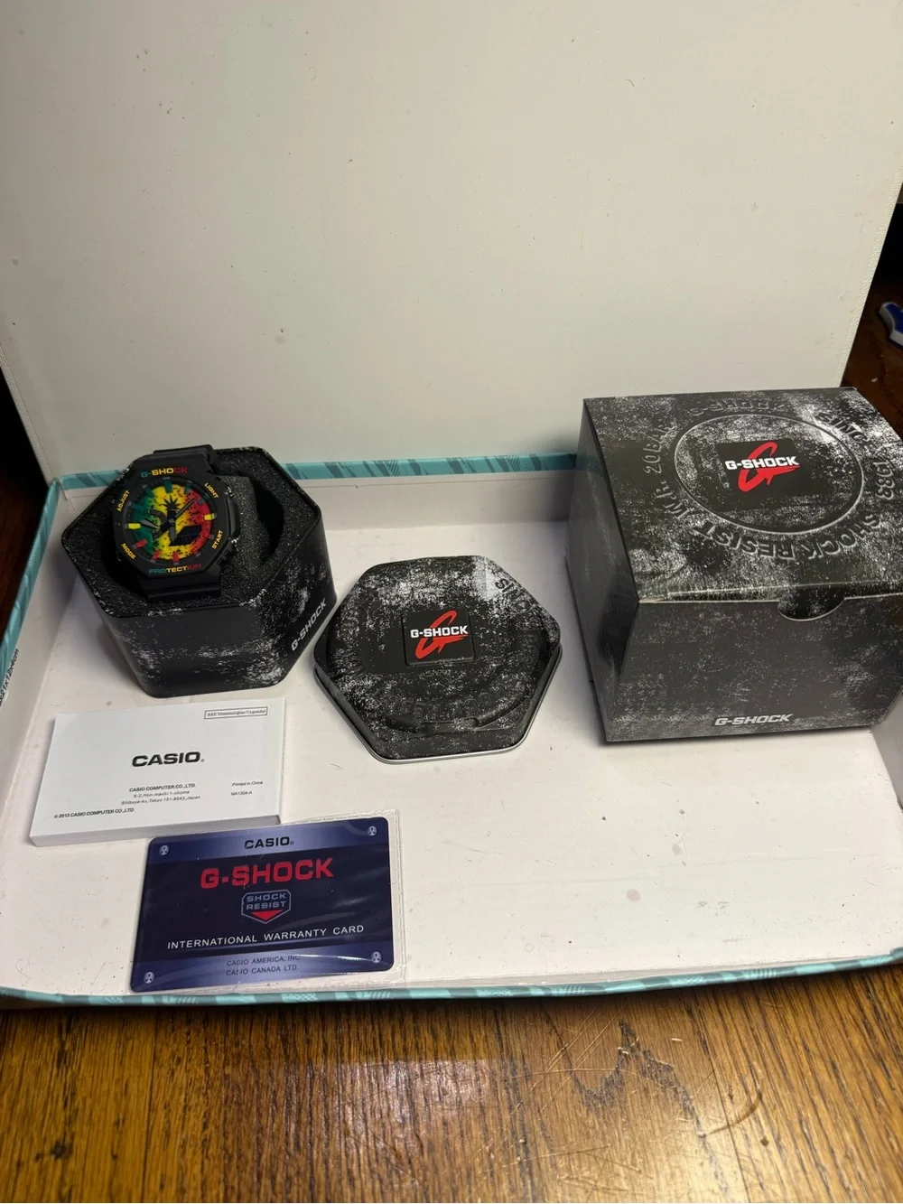 G-Shock Black Watch with Rasta Red, Yellow, Green Dial